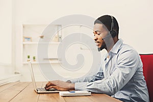 Call center operator man with headset working