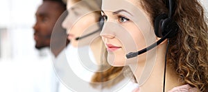 Call center operator.Young beautiful brunette woman in headset. Business concept