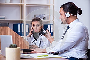 Call center operators working in the office