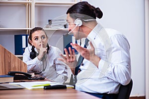 Call center operators working in the office