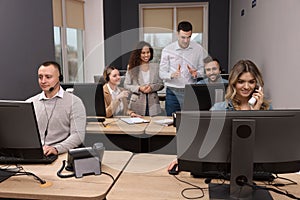 Call center operators working in modern office