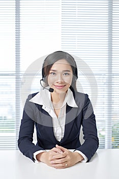 Call center operators. Young beautiful business woman in headset photo