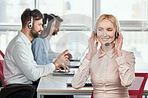 Call center service operator listening to headset.