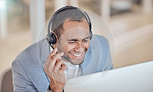 Call center, smile and man at computer for telemarketing, support and crm in office. Contact us, reading and customer