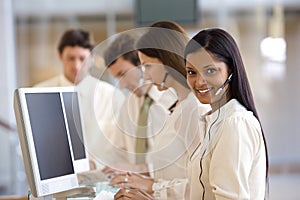 Call center with smiling woman photo