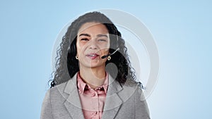 Call center, woman and face in studio for customer service, CRM questions and IT communication on blue background