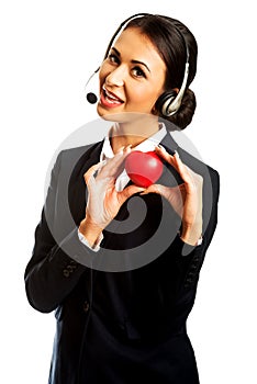 Call center woman holding heart model