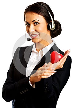 Call center woman holding heart model