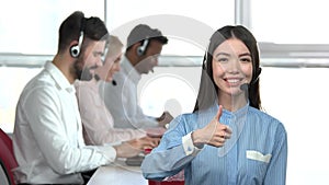 Call center young brunette woman cheering up.