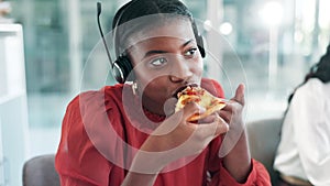 Call centre agent, lunch and customer service by computer at desk and eating pizza at work. Telemarketing employee