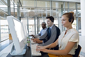 Call centre agents working in open plan office