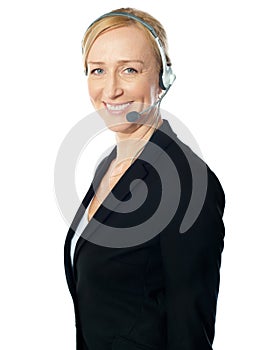 Call centre excutive posing with headsets photo