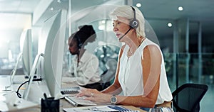 Call centre, talking and mature woman with computer for communication, support or customer service. Office, virtual help