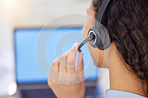 Call us today for a quote. Closeup shot of a young call centre agent working on a laptop in an office.