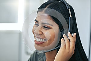 Callcenter, phone call and Indian woman in office for customer service, telemarketing and headset at help desk. Advisor