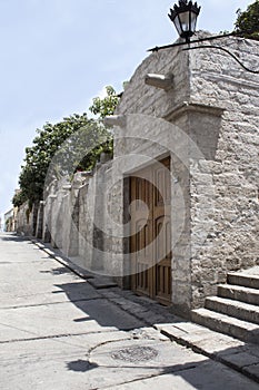 Callejon de la Casa Encantada street in Yanahuara district, Arequipa, Peru. Street made of sillar, volcanic rock photo