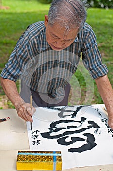 Calligrapher creating work