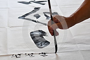 A calligrapher writing ChineseChinese characters