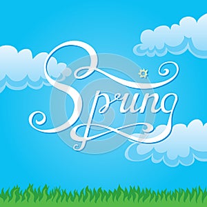 Calligraphic hand lettering spring is located on background of sky, grass and clouds