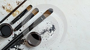 Calligraphy brush set and ink pots on clean background artistic tools studio setting creative perspective art concept