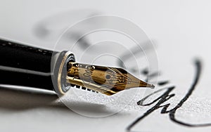 Calligraphy Pen With a Sheet of Handwritten Paper. Classic Fountain Pen