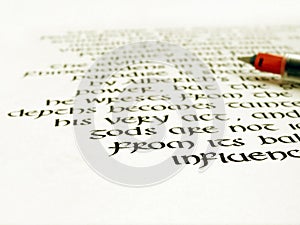 Calligraphy pen and writing on white paper photo