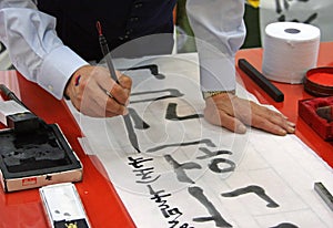 Calligraphy teacher writing