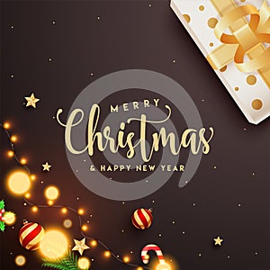 Calligraphy text Merry Christmas & Happy New Year with gift box, baubles, star, candy cane.