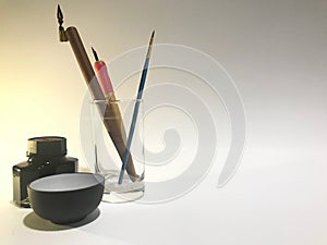 Calligraphy tool set with pen holder, brush and ink
