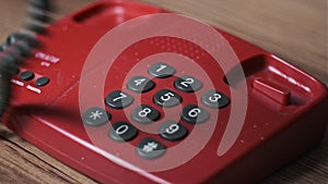 Calling 911 On an Old Retro Red Telephone with Dial Buttons
