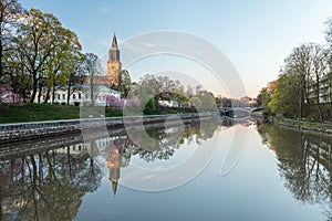 Calm Aura river and the cathedral in Turku, Finland in spring morning