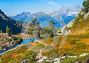 Calm autumn Alps mountain lake with clear transparent water and reflections. Spiegelsee or Mirror Lake, Reiteralm, Steiermark,