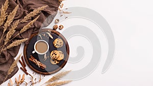 Composition of coffee, biscuits and spicas on white