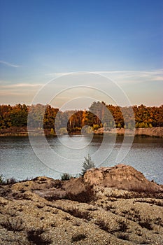 Calm autumn lake in the evening at sunset