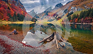 Calm autumn scene of Swiss Alpswith Santis peak on background. photo