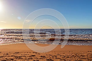 Calm Baltic sea seashore beach background in golden hour