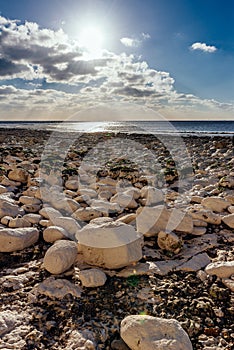 Calm beach full of rocks