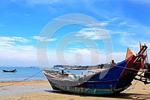The Calm beach and stranded fish boats