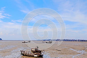 The Calm beach and stranded fish boats