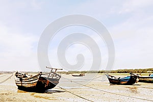 The Calm beach and stranded fish boats