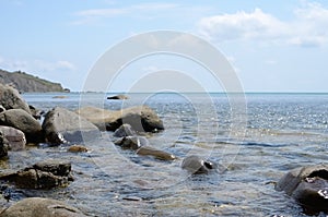 The calm Black sea with the large stones at noon