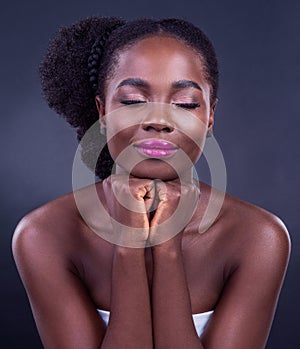 Calm black woman, makeup or face for beauty, skincare, natural cosmetics or healthy shine isolated in studio. Eyes