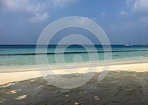 Calm blue sea beach in tropical at Maldives island. Soft focus of blue sky