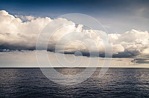 Calm blue sea. Dramatic clouds. Quiet seascape. Relaxed background. Water landscape. Atlantic ocean near the Canary Islands