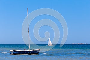 Calm blue sea with sailboats