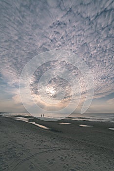 calm blue sunset over clear water in baltic sea - vintage retro film look