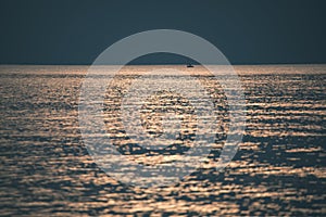 calm blue sunset over clear water in baltic sea - vintage retro film look