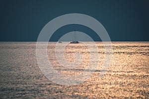 calm blue sunset over clear water in baltic sea - vintage retro film look