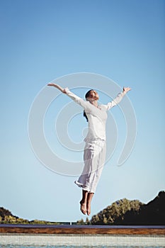 Calm brunette jumping