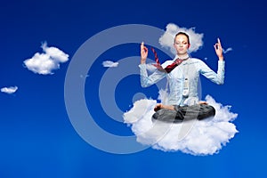 Calm business woman meditating sitting on cloud